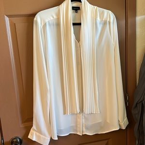 Ivory button down dress shirt with decorative tie.